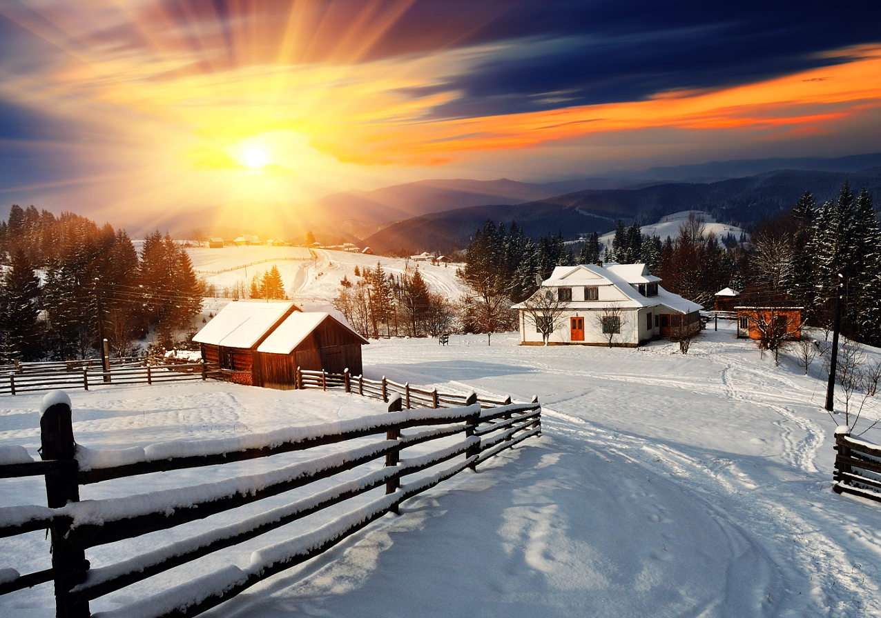Zachód słońca nad górską wioską zasypaną śniegiem puzzle ze zdjęcia