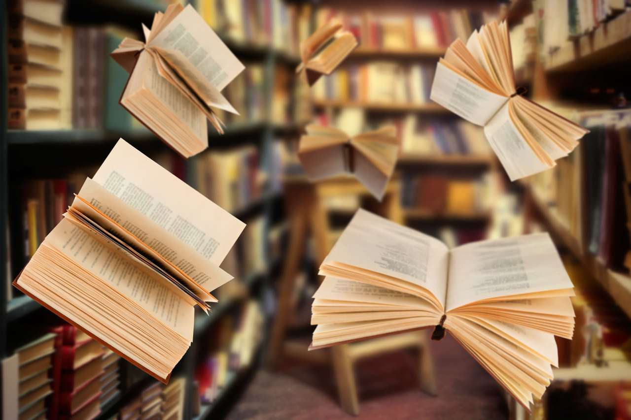 Latające książki otwarte w bibliotece puzzle online