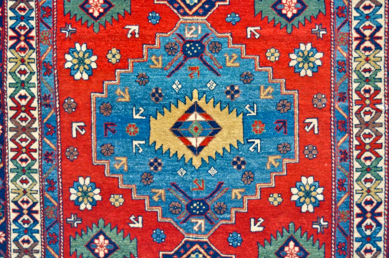 Kolorowa wełna ręcznie robiony dywan zbliżenie puzzle online ze zdjęcia