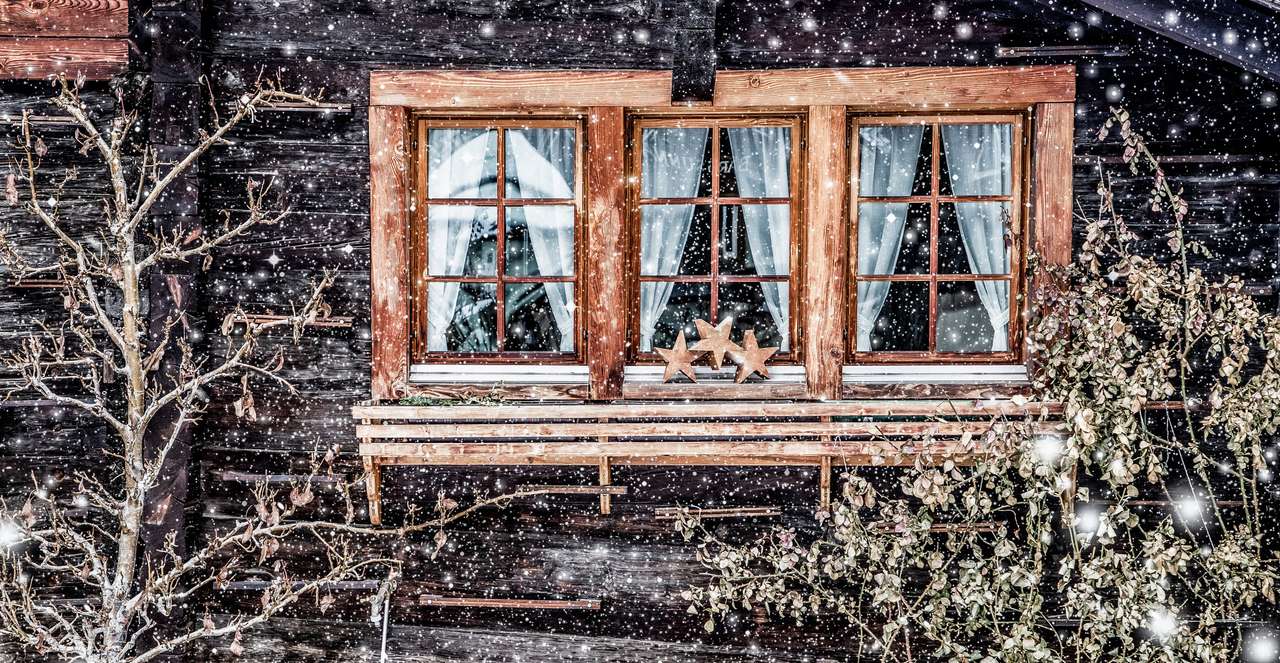 Tradycyjna szwajcarska drewniana chata i opady śniegu puzzle online ze zdjęcia