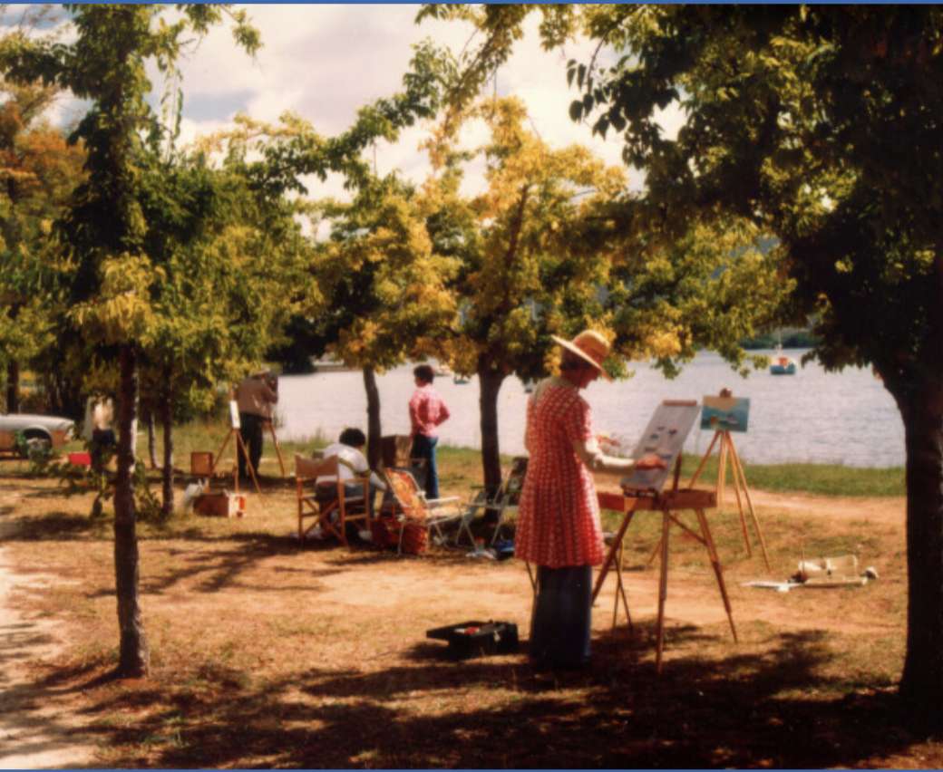 Ludzie malują i cieszą się wiosennym słońcem puzzle ze zdjęcia