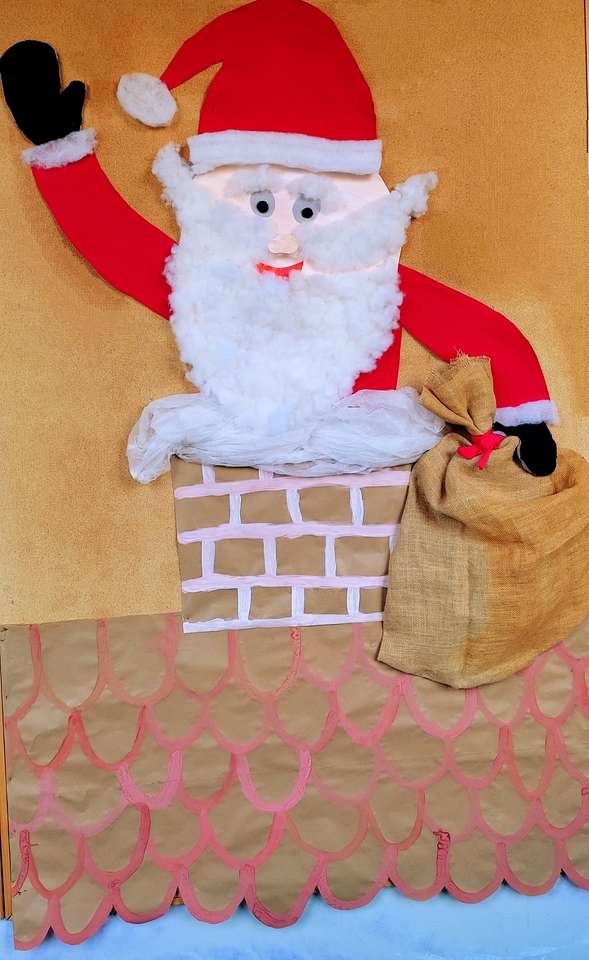 Mikołaj w kominie puzzle ze zdjęcia